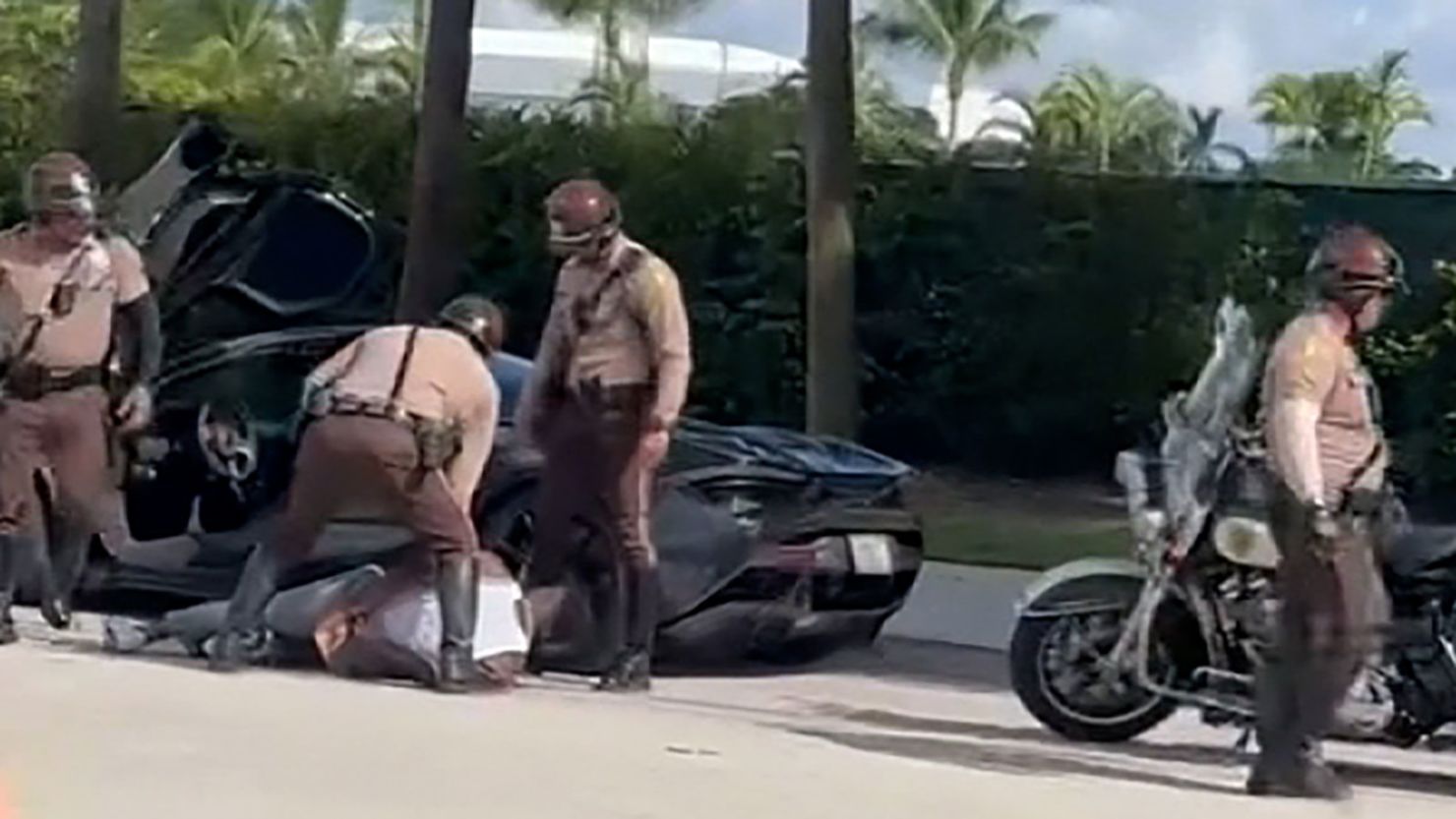 Police detain Miami Dolphins wide receiver Tyreek Hill, here on the ground, during a traffic stop on September 8, 2024.