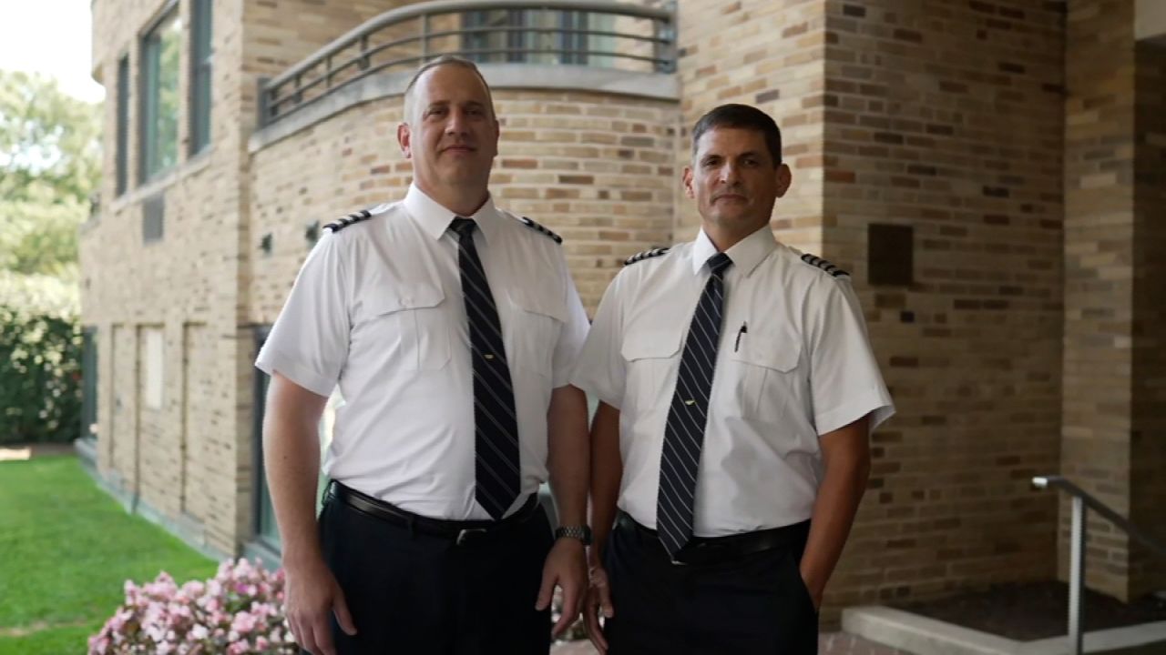 Fedex pilots Robert Bradeen, left, and Hugo Carvahal pose for a portrait after an interview with CNN.