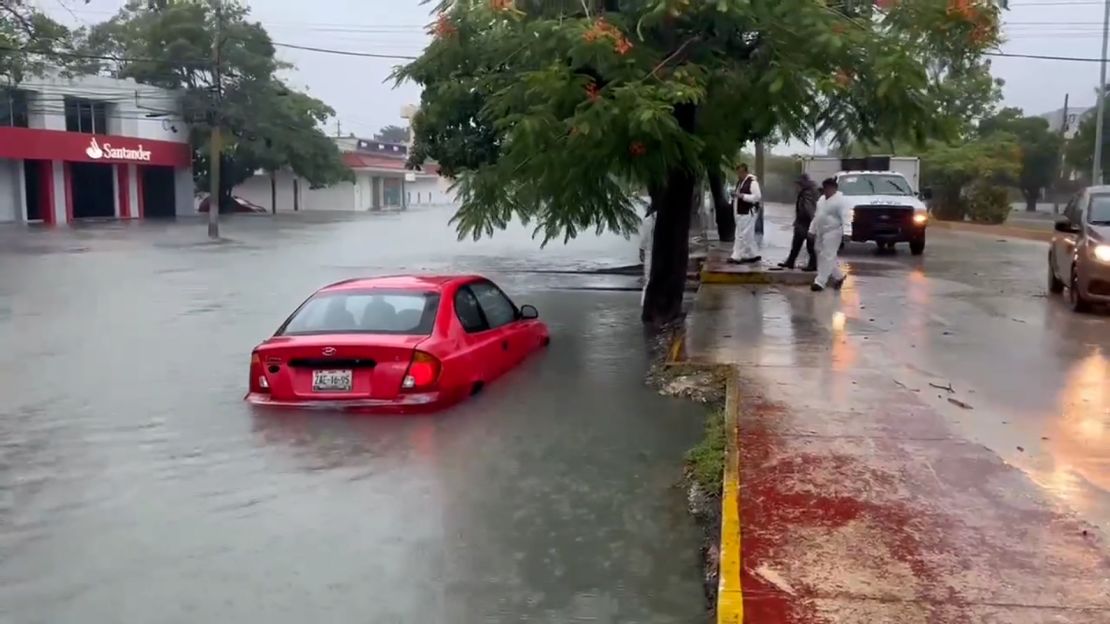 A car is submerged in flooded streets in flooding caused by Hurricane Helene in Quintana Roo, Mexico, on Wednesday.