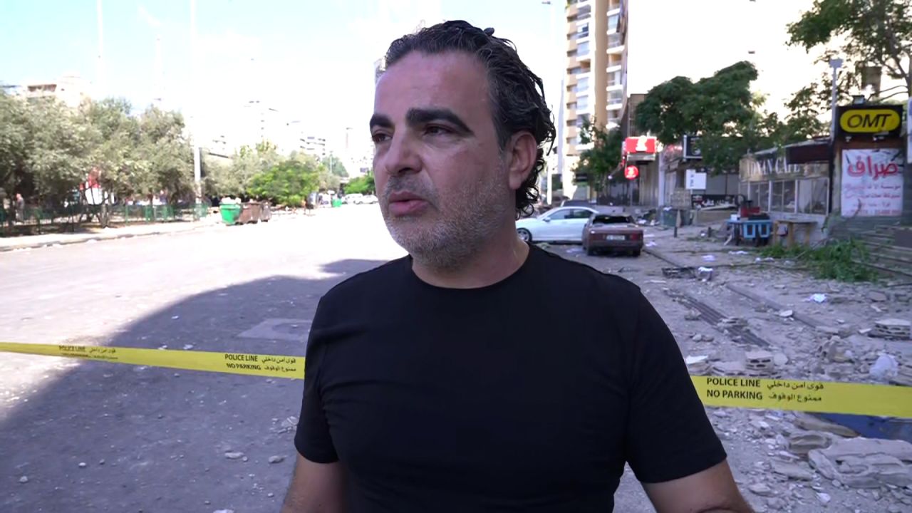 Muhammad Darwish, shown in central Beirut, Lebanon, on Monday, says he saw body parts strewn in the street, after an attack on a residential building early Monday.