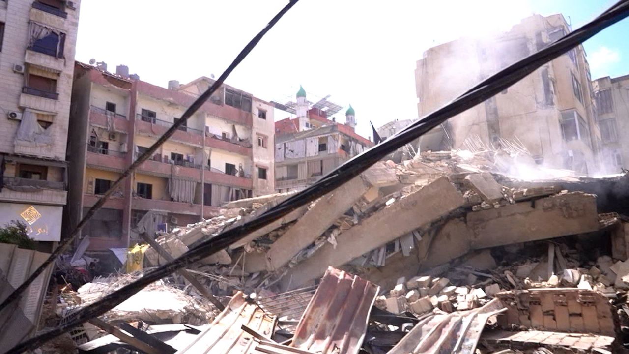 Smoke rises over rubble left after an Israeli strike in the suburbs of Beirtu on Wednesday, October 2.