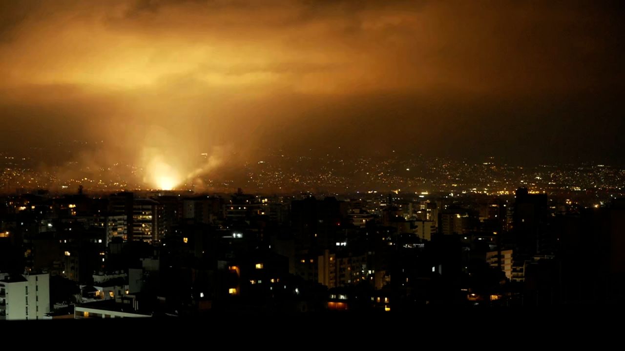 An explosion on Monday, October 7, lights up the sky over  Beirut's southern suburbs.