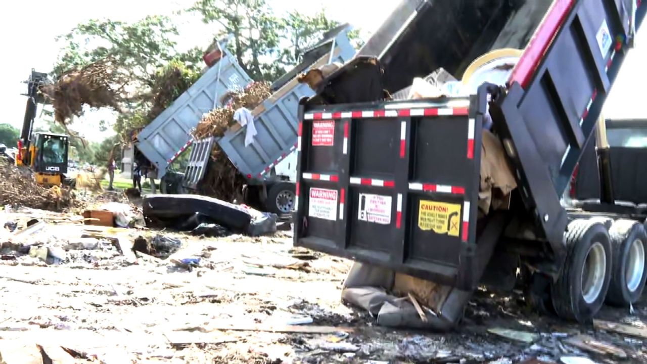 Storm debris from Hurricane Helene is transported to the Florida State Fairgrounds in Tampa on Tuesday.