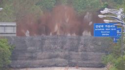 A screengrab taken from a video shows an explosion, as North Korea blows up part of a road connected to the southern part of the peninsula on October 15, 2024. 