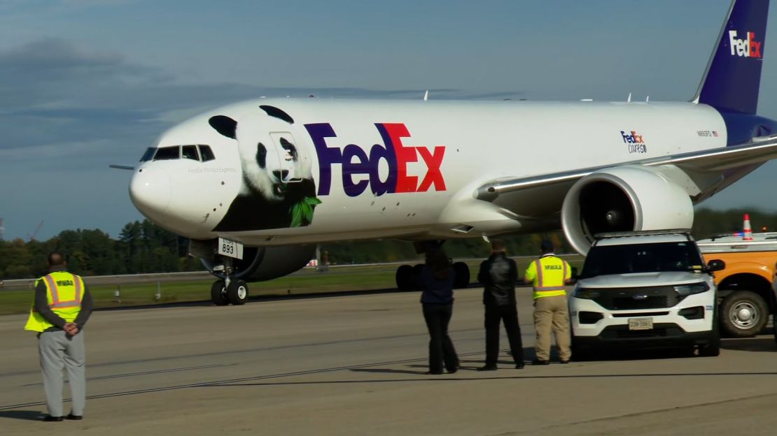 A FedEx plane carrying two giant pandas arrives at Dulles International Airport on Tuesday.