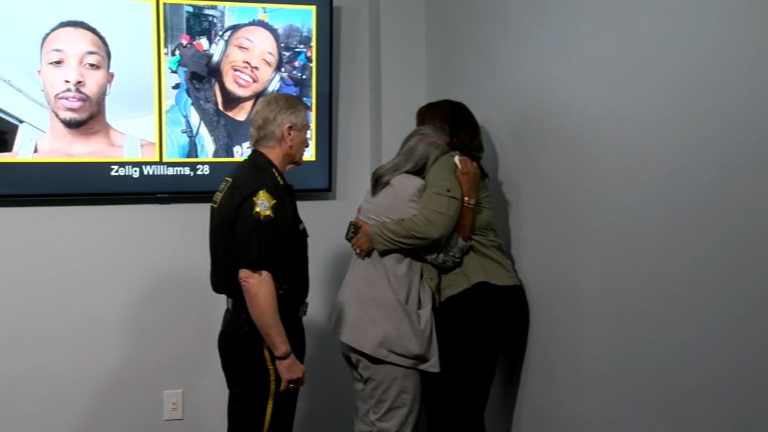 Mieoki Corbett-Jacobs comforts his mother Kathy Williams following a press conference on October 16, 2024.