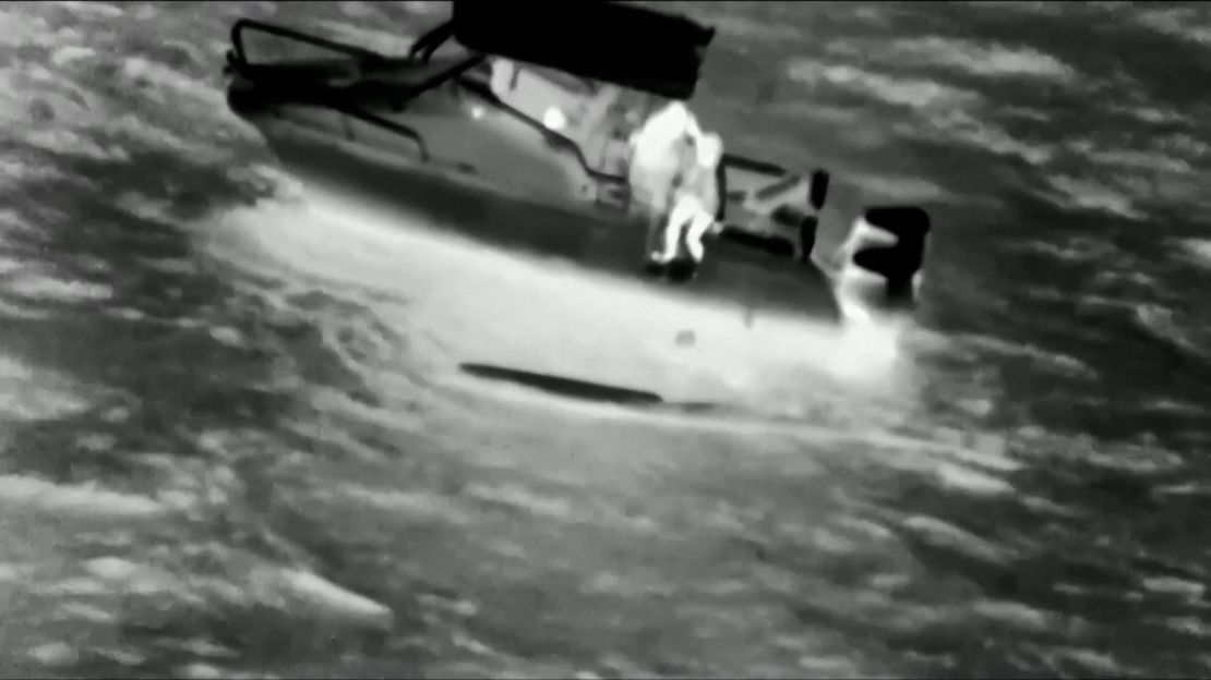 A screenshot from video footage shows Kahiau Kawai being rescued by Noland Keaulana.