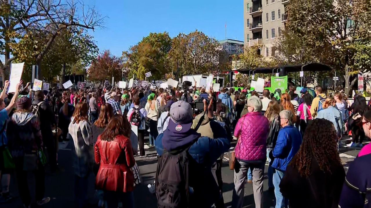 Protesters rally outside the Heritage Foundation in Washington, DC, on Saturday.