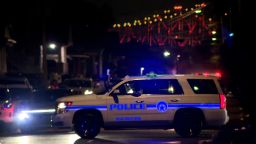Police respond to the scene of a shooting in New Orleans on Sunday, November 17.