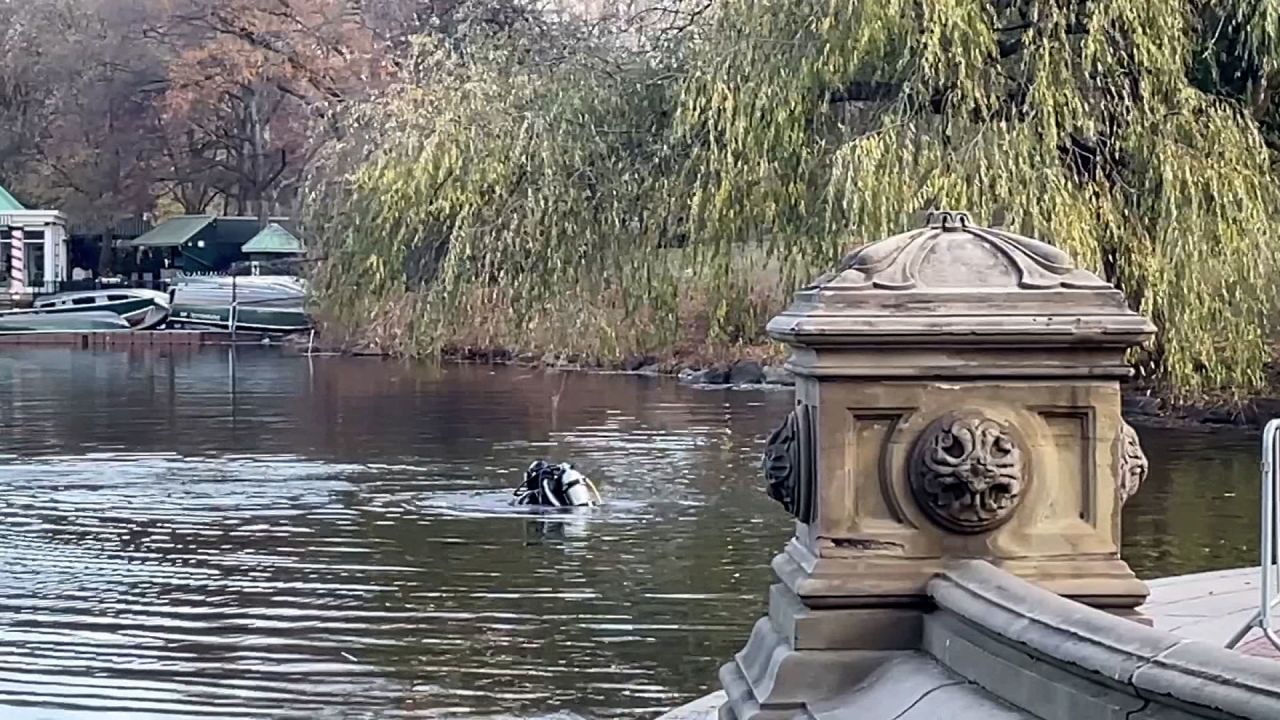 NYPD divers search a pond in New York's Central Park on Saturday, December 7, in connection to the shooting death of UnitedHealthcare CEO Brian Thompson.
