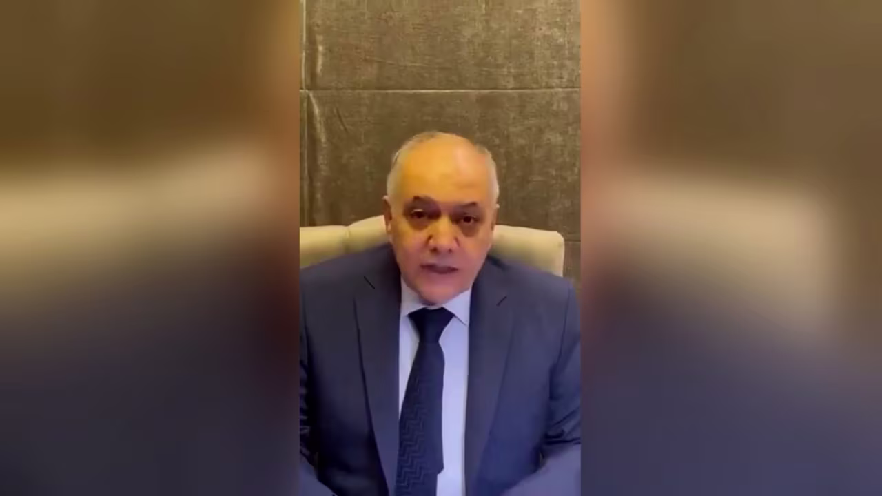 A still from a video posted Sunday, December 8, local time, shows Syrian Prime Minister Mohammad Ghazi al-Jalali giving a recorded message.