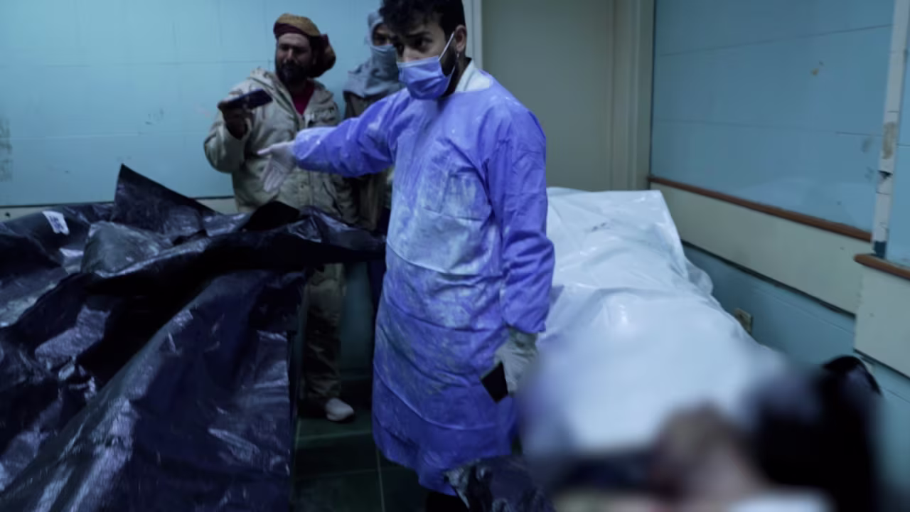   Battered bodies inside the morgue of Mujtahid Hospital. Part of this image has been obscured by CNN.