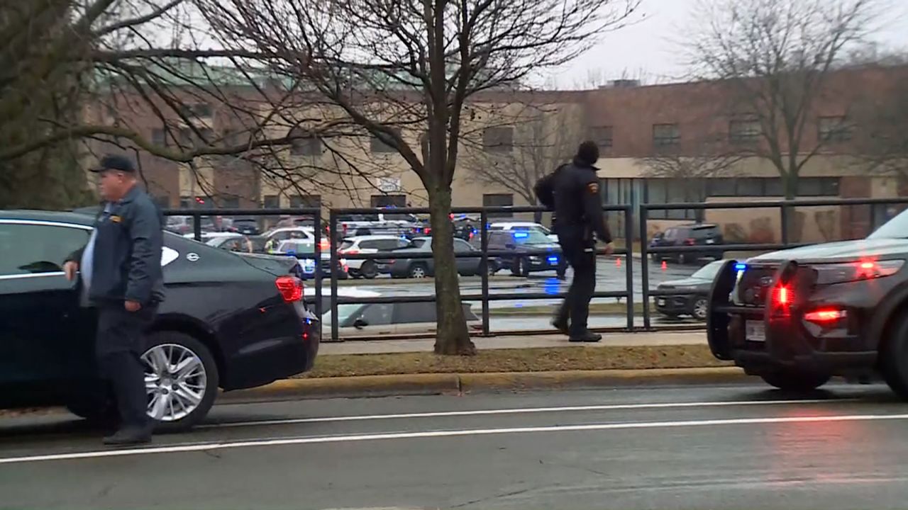 Emergency officials work the scene of a shooting at Abundant Life Christian School in Madison, Wis., on Dec. 16.