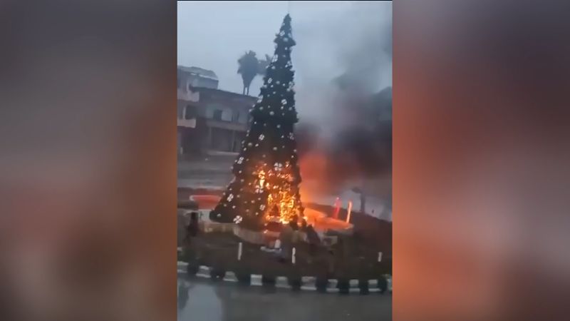 Christians protest in Syrian capital after burning of Christmas tree