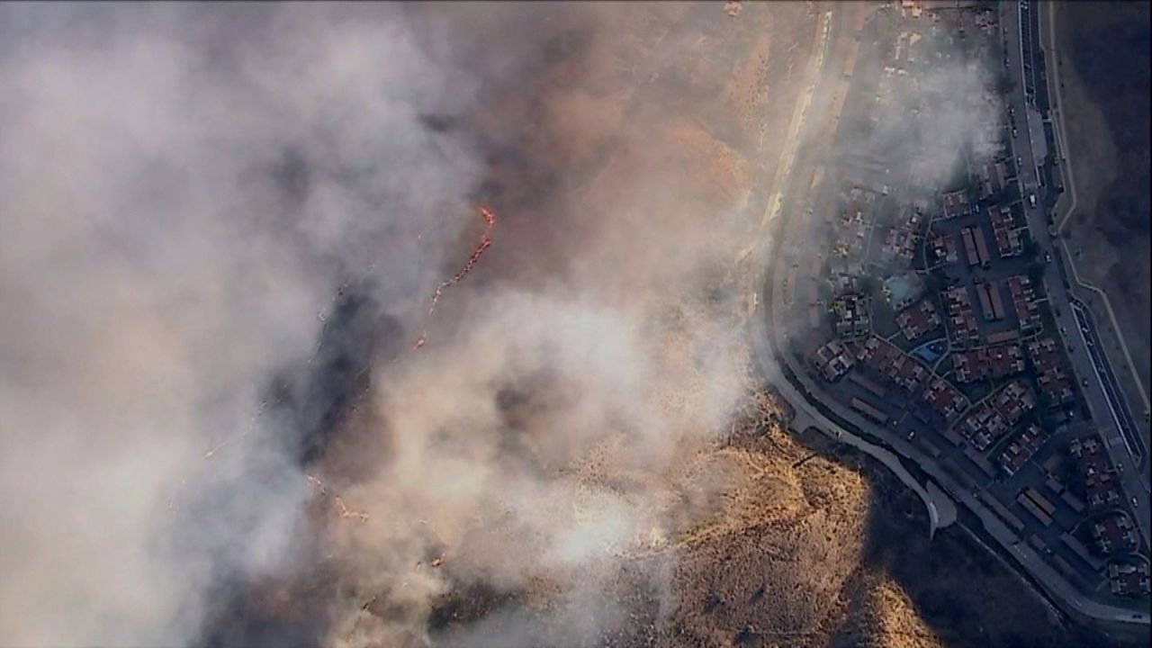 This aerial image shows the Kenneth Fire approaching residential areas.