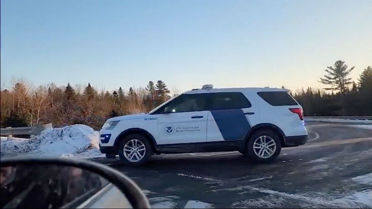 A US Customs and Border Protection vehicle is parked near the scene of the fatal shooting on Monday near Newport, Vermont.