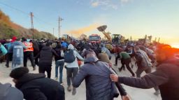 Gazans hoping to return to their homes in northern Gaza run after the Israeli military opened fire to prevent them from crossing into the area on Saturday, January 25.