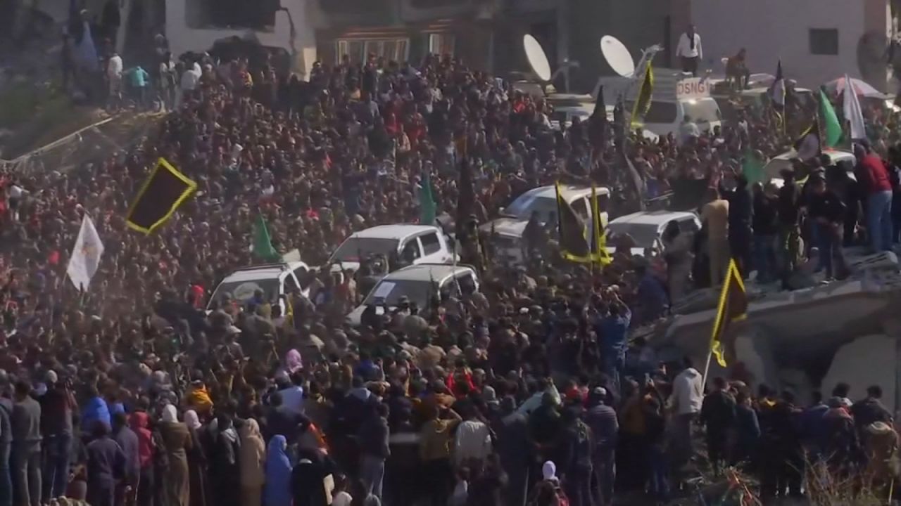 A van makes its way through a huge crowd in Khan Younis, Gaza, on Thursday.