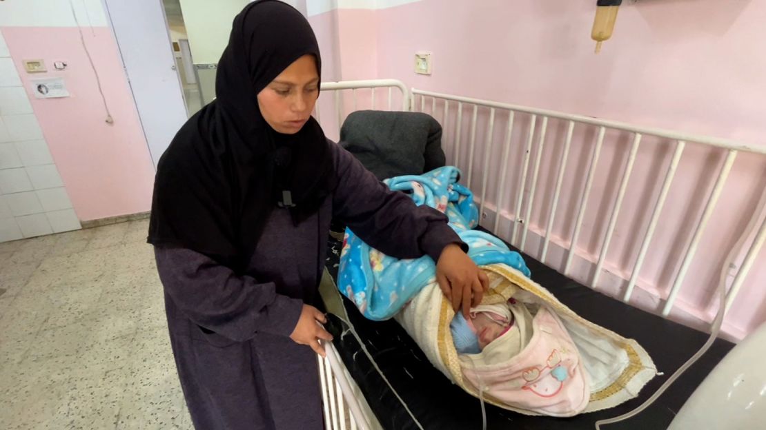 A Palestinian mother tends to her two-month-old baby, Yousaf, a hypothermia patient at Nasser Hospital, southern Gaza, on February 25.