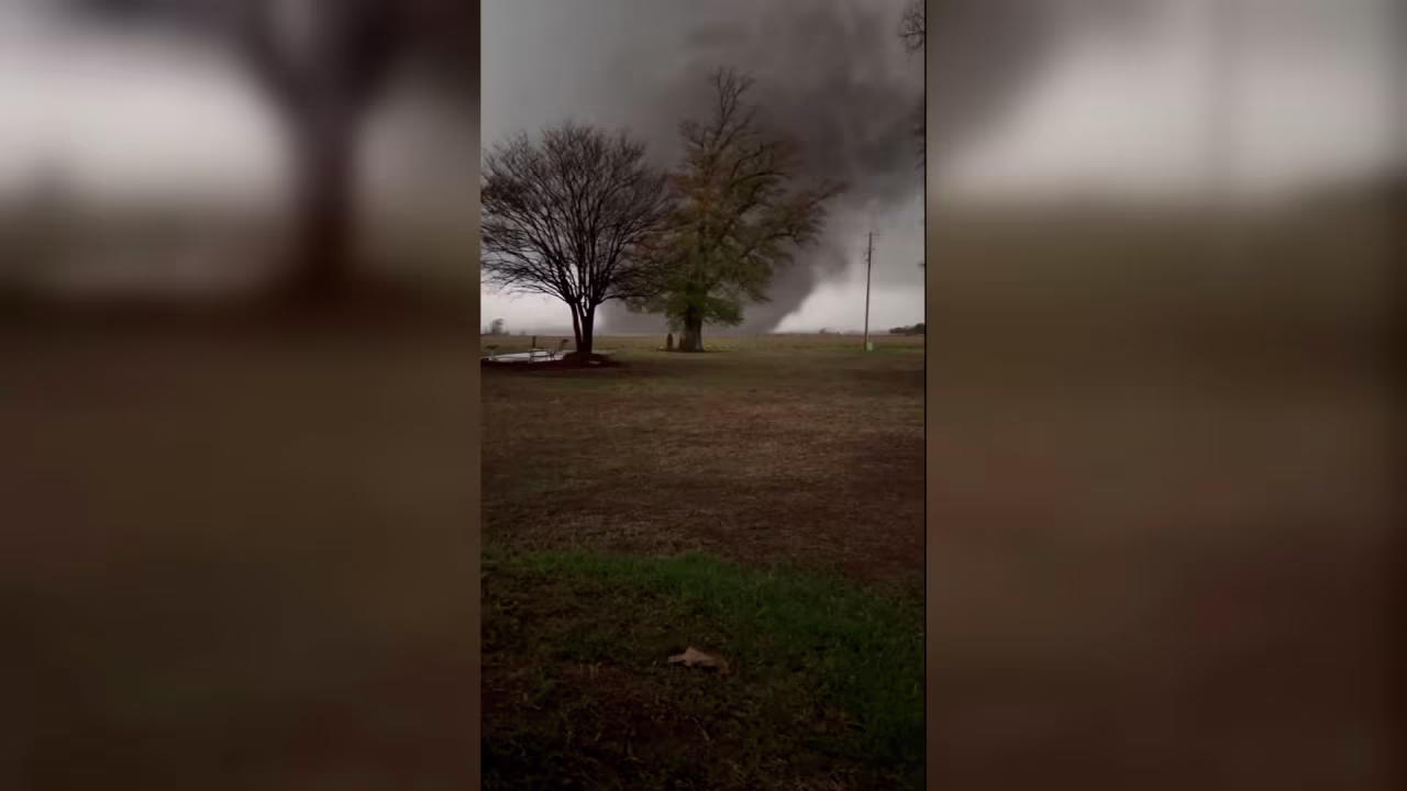 This screengrab taken from a video shows what appears to be a tornado advancing across an open field in Lake City, Arkansas, on Wednesday.