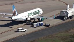 A Frontier plane sits on the ground at Washington Dulles International airport in Virginia after a beeping noise was heard from the cargo hold Wednesday, April 9, 2025.