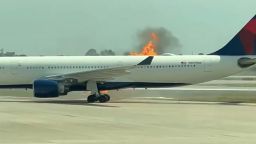 Flames and smoke coming from the right side of a Delta Air Lines aircraft on Monday morning. Passengers evacuated down emergency slides on the tarmac of Orlando International Airport.