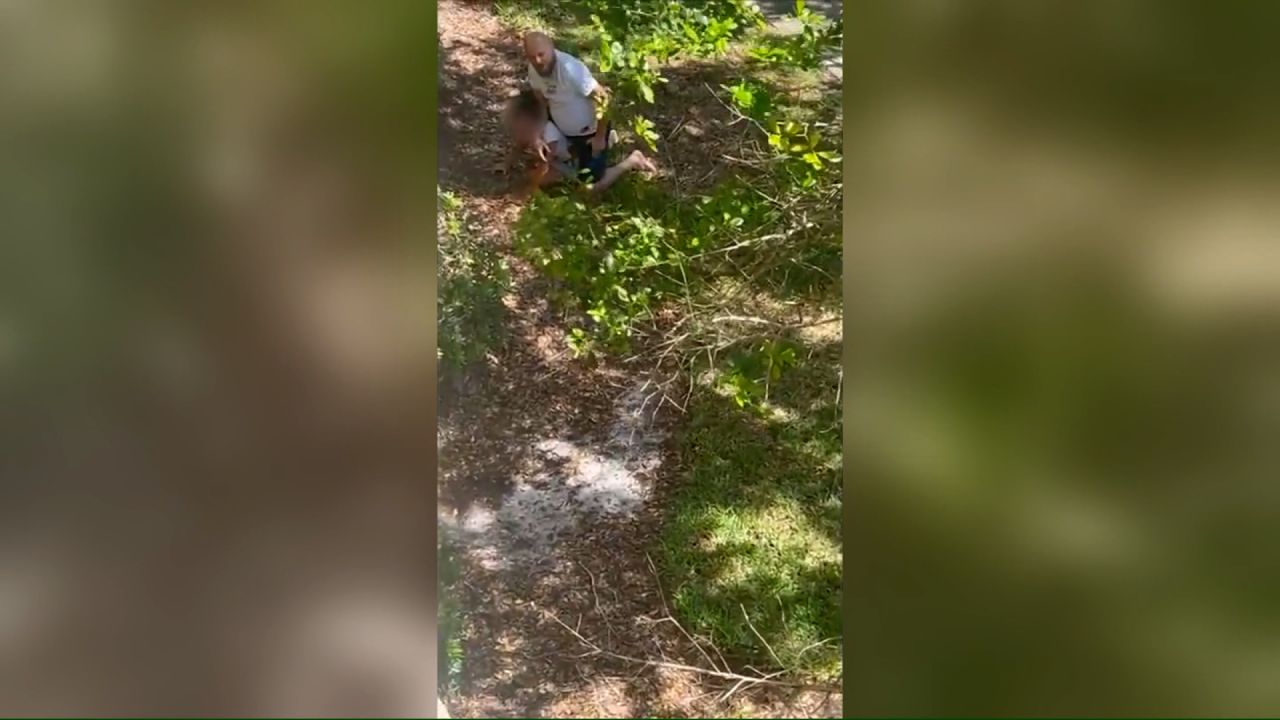 In this screengrab taken from video, Marius Mutu is seen pinning an 11-year-old girl to the ground.