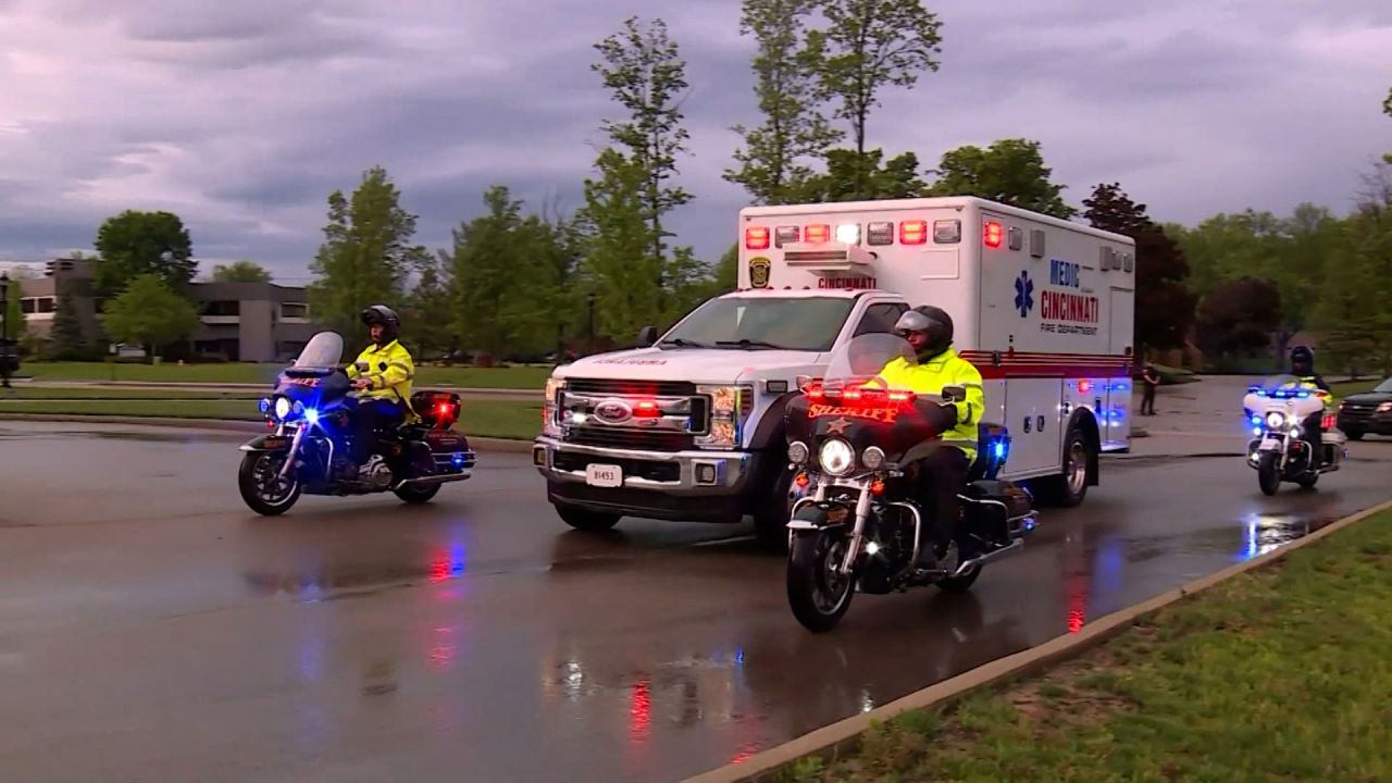 The body of an Ohio sheriff's deputy who was intentionally struck by a car is escorted to the University of Cincinnati's medical center on Friday, May 2, 2025.