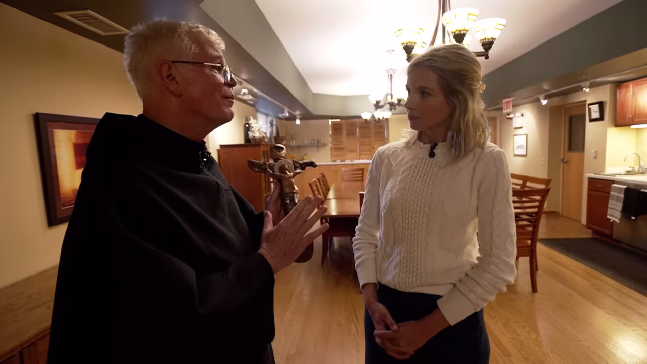 Rev. John Lydon talks with CNN's Whitney Wild during a tour of the Augustinian Formation House at CTU, where Pope Leo lived and worked before he was named a bishop in Peru.