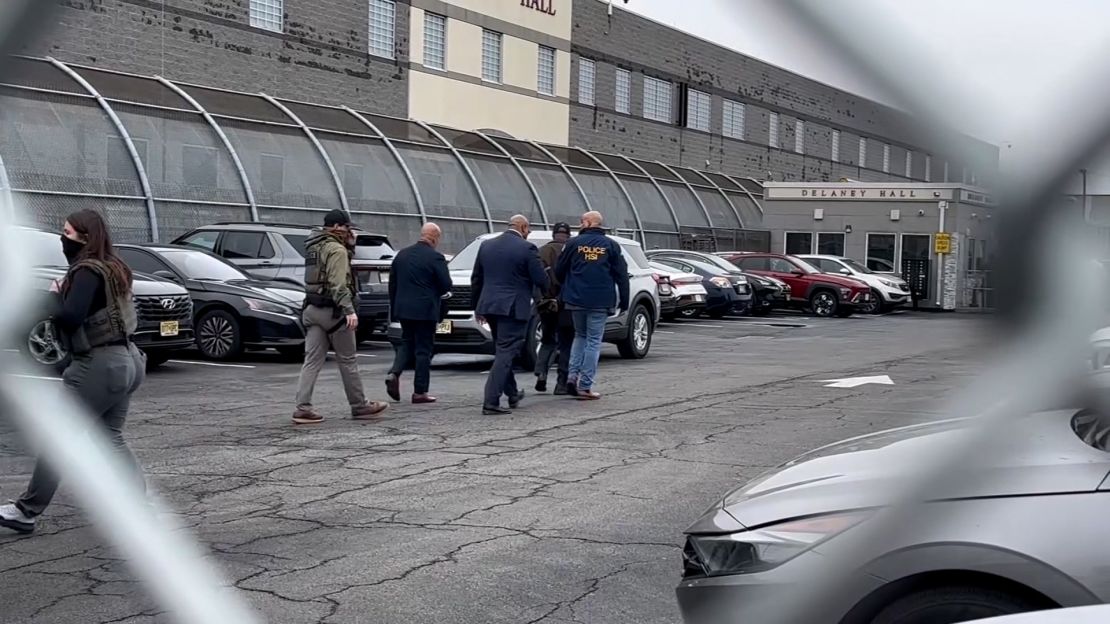 Newark Mayor Ras Baraka is led away in handcuffs after he took part in a protest outside an ICE facility in Newark, New Jersey, on Friday.