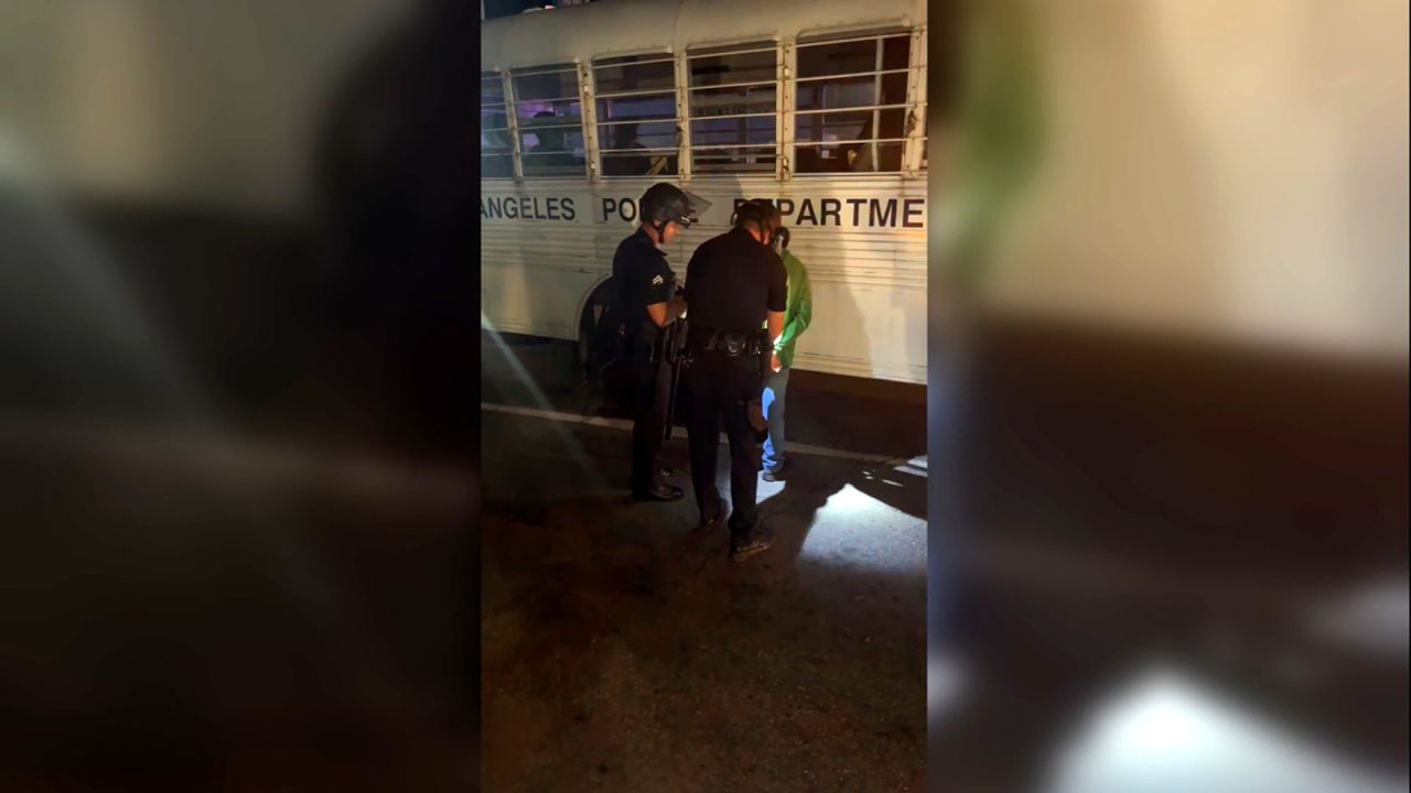 Video shot by CNN appears to show detained protestors being loaded onto an LAPD bus.