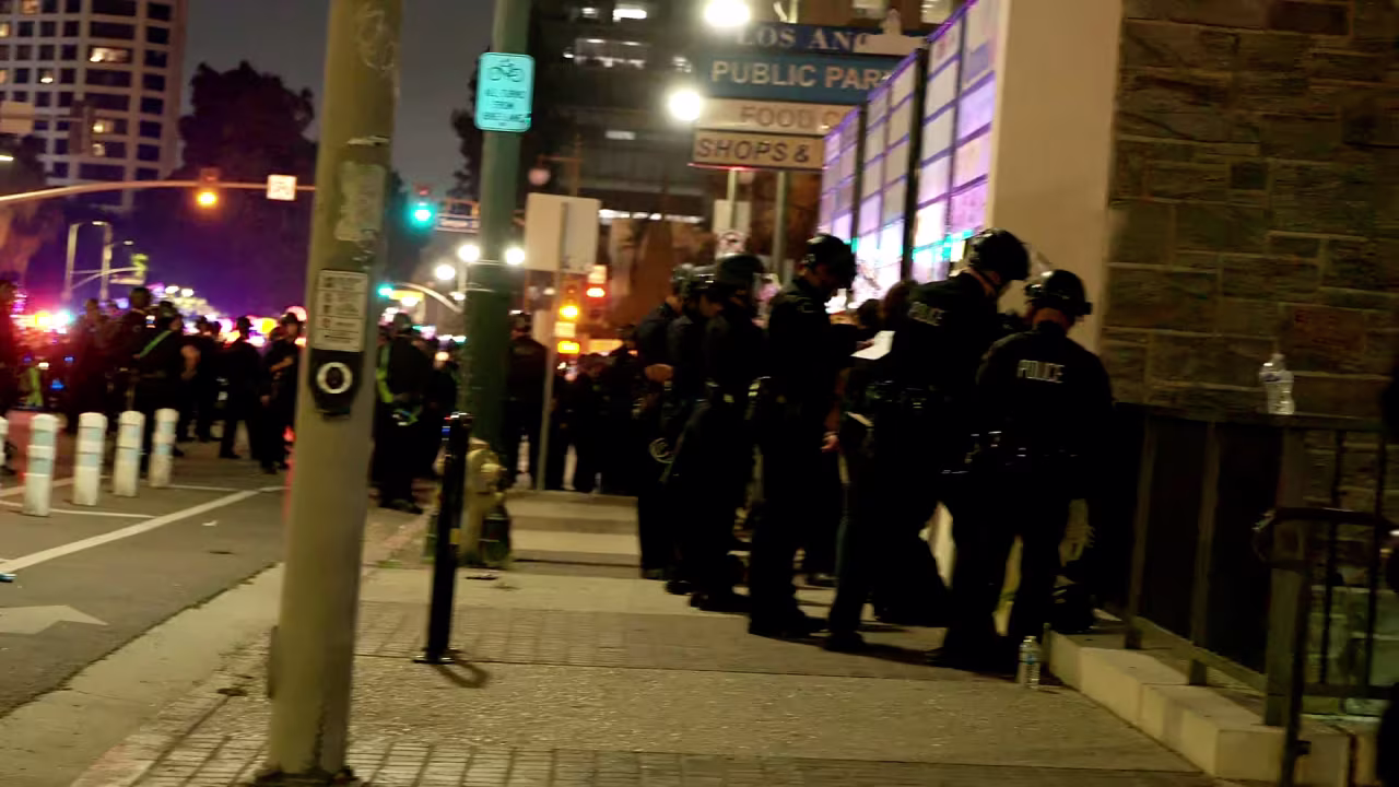 In this screengrab taken from a video, police begin to detain protesters.