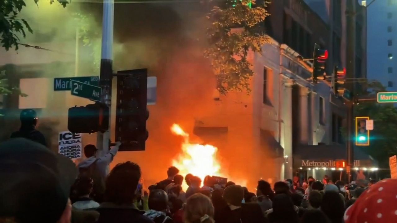 This screengrab taken from a video shows a fire burning during a protest against Immigrations and Customs Enforcement in Seattle, Washington, on Wednesday, June 11, 2025. 