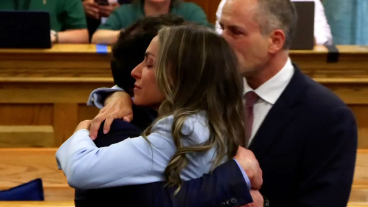 Karen Read hugs her attorney Robert Alessi after her verdict is read in court on Wednesday.