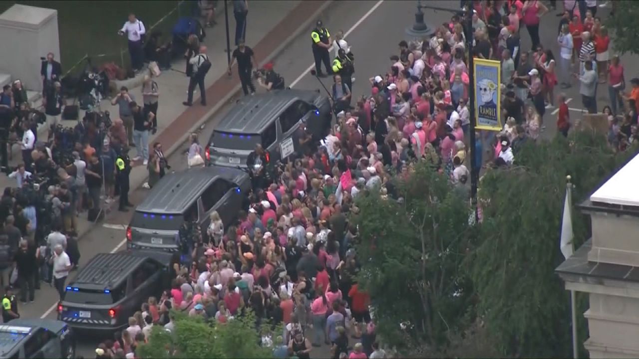 People gather outside of the courthouse in Dedham on Wednesday