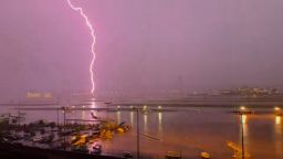 A lightning strike is seen from Atlanta’s Hartsfield-Jackson International Airport on Friday.