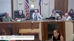 A Kerr County resident speaks at a Kerr County Commissioners meeting on Monday.