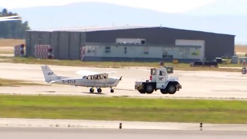 The plane is towed away.