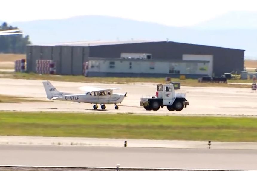 The plane is towed away after the hijacking suspect was arrested at Vancouver International Airport, Tuesday, July 15, 2025.