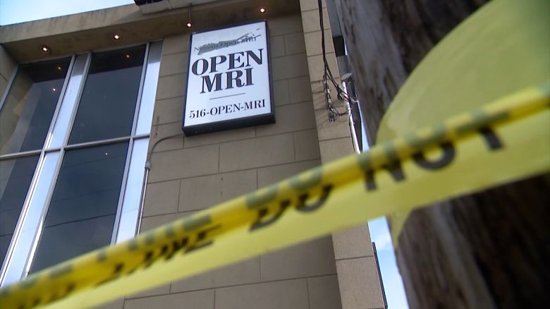 Police tape is seen outside Nassau Open MRI after a man was pulled into an MRI machine.