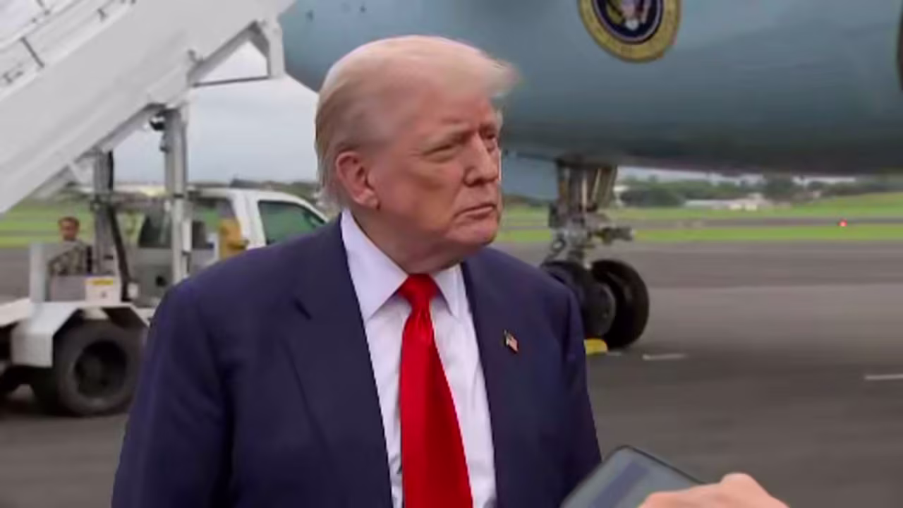 President Donald Trump speaks with members of the media after arriving in Scotland on Friday.