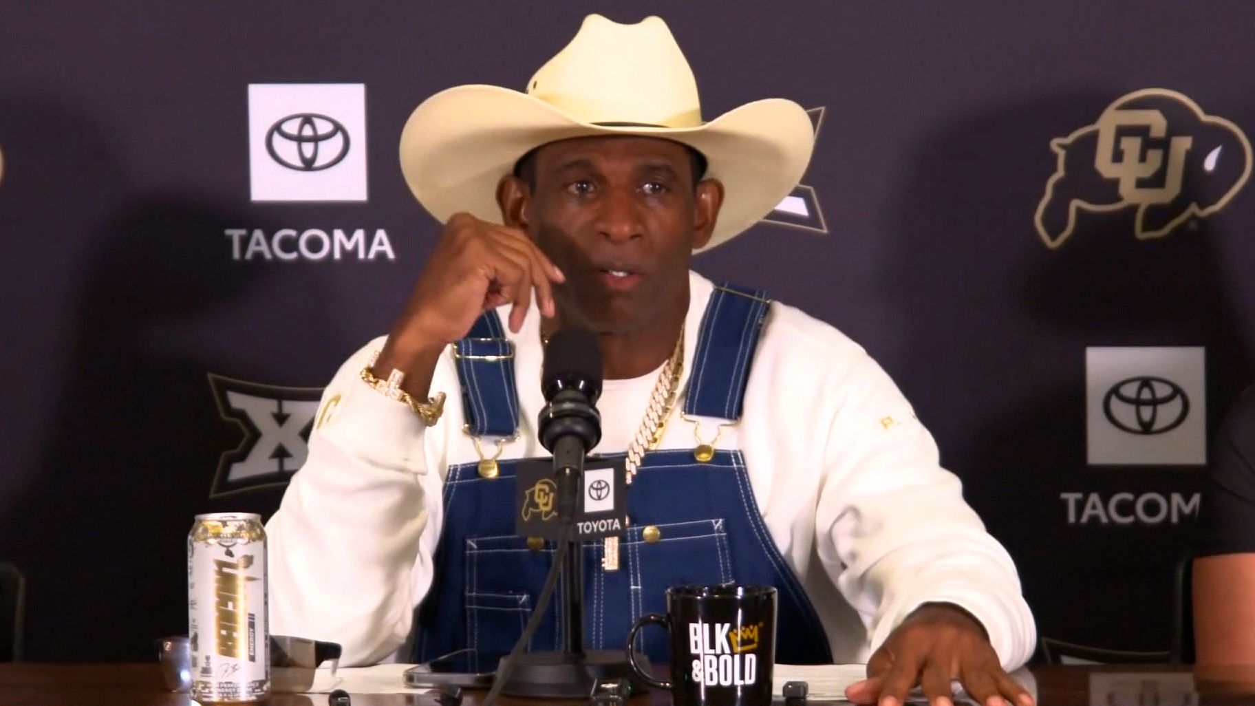 Colorado head coach Deion Sanders talks to reporters on Monday.