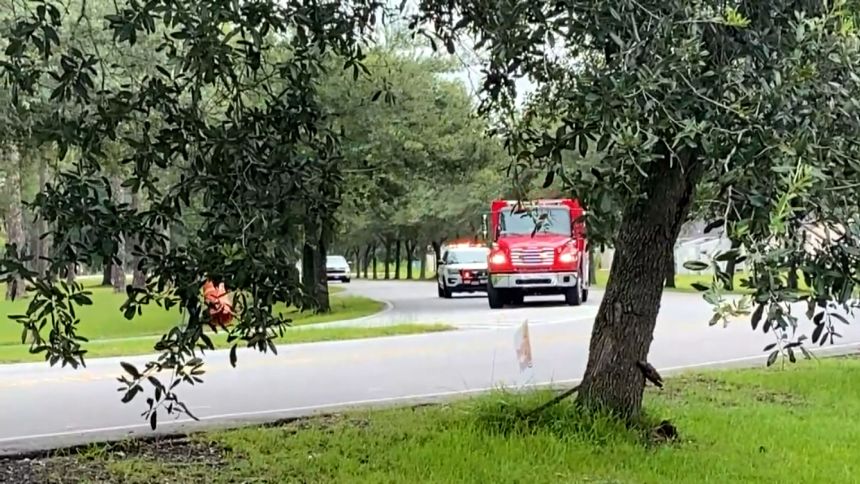 First responders drive toward Fort Stewart on Wednesday in Georgia.