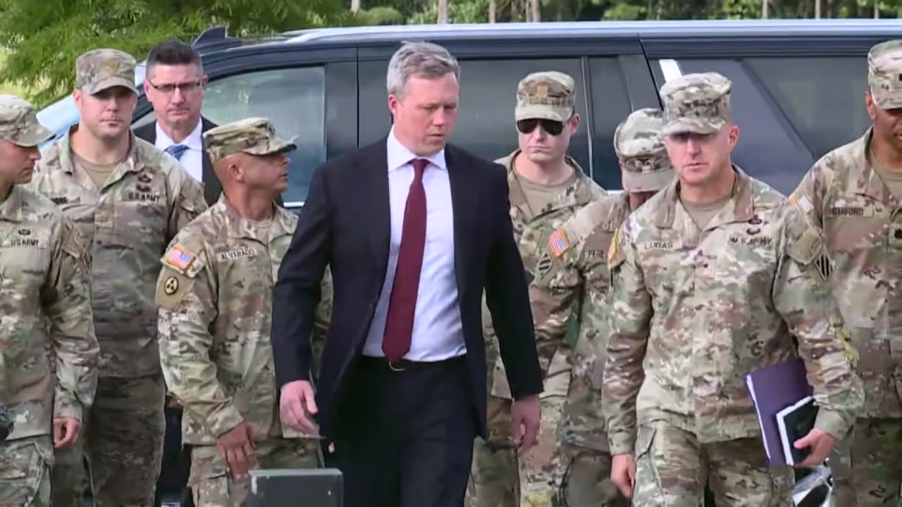 Army Secretary Dan Driscoll walks with soldiers as he arrives at Fort Stewart on Thursday.