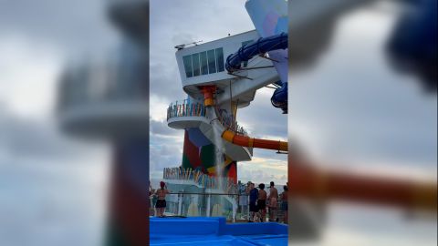 Water pours out of an Icon of the Seas waterslide after it cracked on Thursday.
