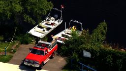 Investigators search the Mississippi River after receiving word of a car found in the river in Sartell, Minnesota, on August 14.