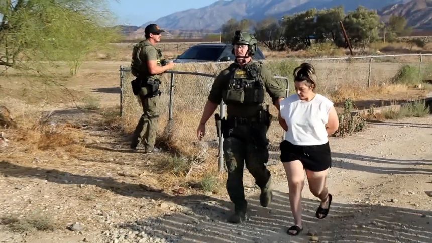 Rebecca Haro is seen being arrested at her home on August 22 in Cabazon, California.