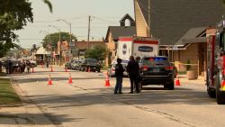 Police work the scene of a shooting where a person was fatally shot and an ICE officer was injured during a traffic stop in Franklin Park, Illinois, on Friday.