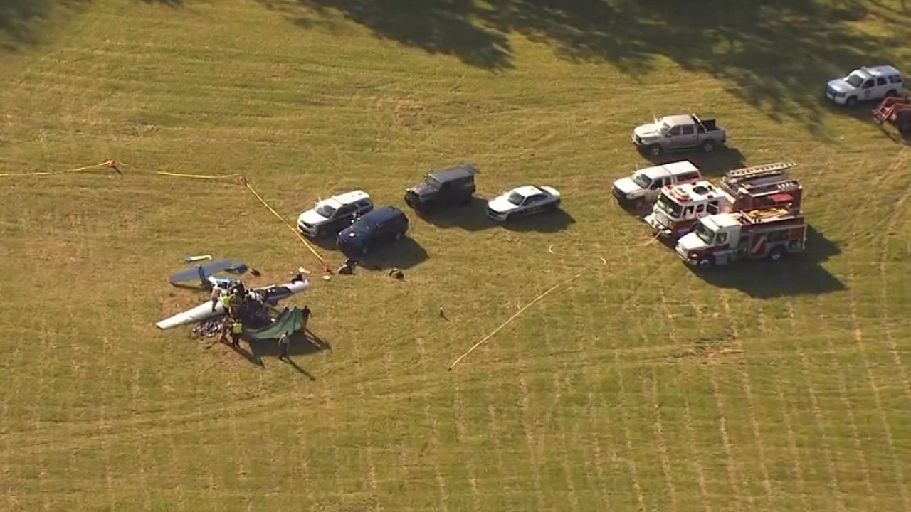 Investigators examine wreckage of Brett James' plane which crashed in Macon County, NC on Sept. 18.