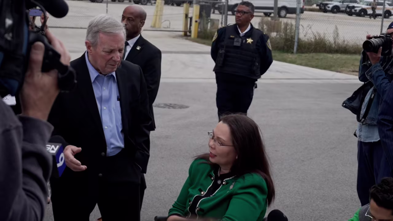 Sen. Dick Durbin and Sen. Tammy Duckworth outside the Broadview ICE facility on Friday.